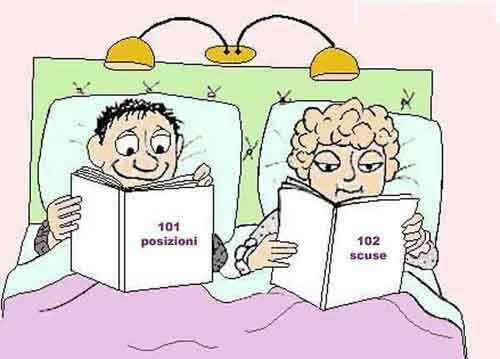Uomo e donna a letto con libri